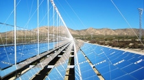 Utility-scale solar power plant surrounded by montains. Utility-scale solar power plant surrounded by montains.