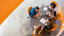People sitting together at one table. People sitting together at one table.