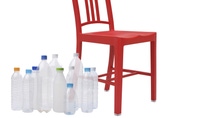 Empty water bottles beside a red chair Empty water bottles beside a red chair