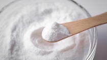 Salt on a wooden spatula. Salt on a wooden spatula.