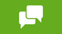 Two white speech bubble icons against a bright green background. Two white speech bubble icons against a bright green background.