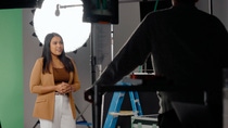 An employee is filmed in a professional studio setting, sharing her experiences and perspectives. Camera equipment, lighting, and crew members are visible, offering a behind-the-scenes view of video production at BASF. An employee is filmed in a professional studio setting, sharing her experiences and perspectives. Camera equipment, lighting, and crew members are visible, offering a behind-the-scenes view of video production at BASF.