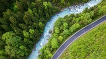 The whitewater river Steyr next to a paved road. The water is still blue from the melting snow in the montains in springtime. Location: next to the small ski resort Hinterstoder in the "Totes Gebirge" area in Upper Austria. The whitewater river Steyr next to a paved road. The water is still blue from the melting snow in the montains in springtime. Location: next to the small ski resort Hinterstoder in the "Totes Gebirge" area in Upper Austria.