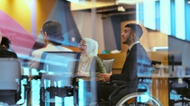 Person in wheelchair in a meeting Person in wheelchair in a meeting