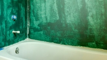 After mudding the sheetrock, the cement board is covered with an impervious membrane to stop any moisture from passing through to the walls. After mudding the sheetrock, the cement board is covered with an impervious membrane to stop any moisture from passing through to the walls.