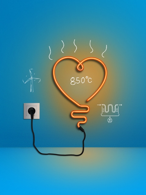 La imagen muestra una luz de neón naranja en forma de corazón enchufada a una pared azul. Hay bocetos blancos alrededor de una turbina eólica, un elemento de calefacción eléctrica y la cifra “850 °C”.