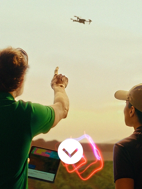 Two farmers flying a drone Two farmers flying a drone