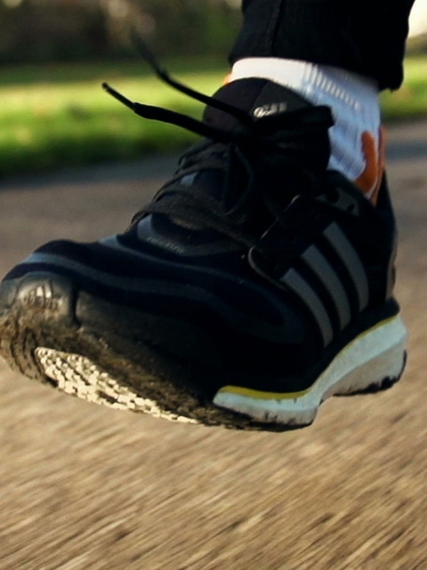 Close up of a runners foot.