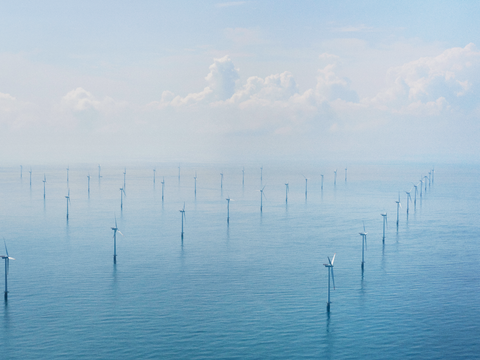 View from above showing several wind turbines in a offshore wind farm View from above showing several wind turbines in a offshore wind farm