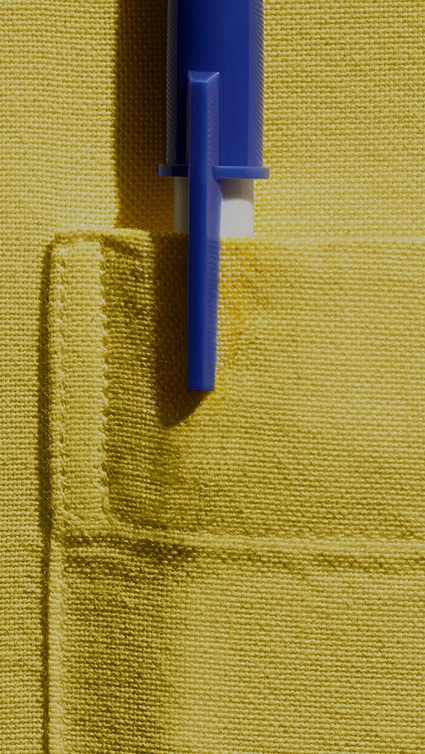Pen in breast pocket, yellow shirt. Pen in breast pocket, yellow shirt.