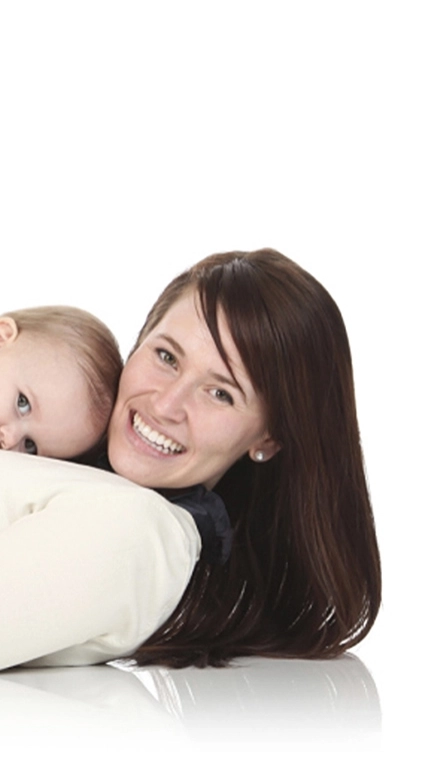 Happy woman laying down holding cute/happy baby laying on her chest 