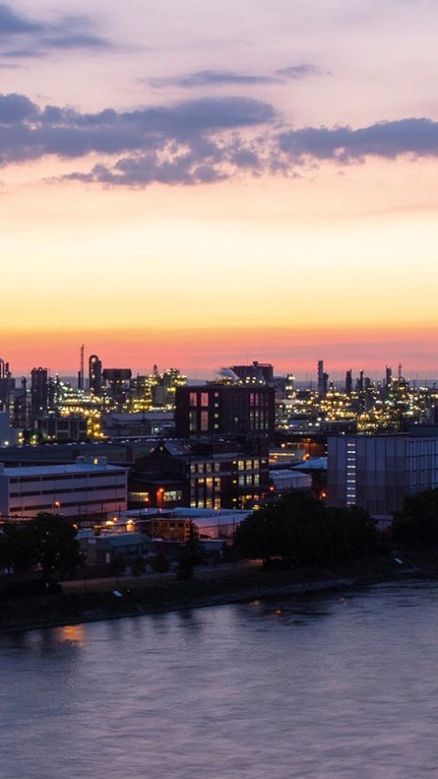 Urban area beside the river during sunset 