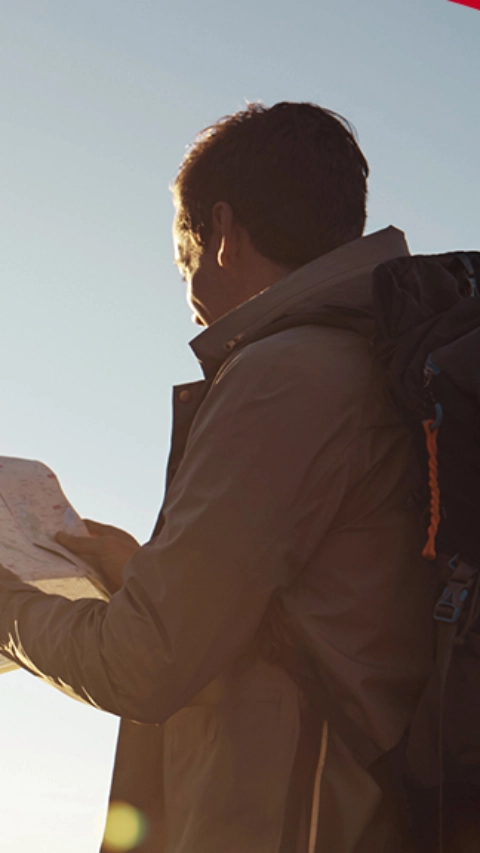 Backpackers looking through a map