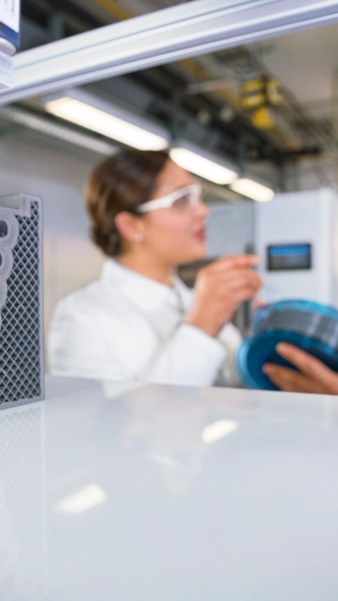 At the Application Technology Center in Heidelberg, Germany, BASF tests new powders, resins, filaments and granulates for 3D printing and develops solutions for industrial additive manufacturing. Fernanda Kraft, application technician 3D printing and Alexander Gengel, application technician 3D printing, during filament and printer preparation before starting a new 3D printing cycle.