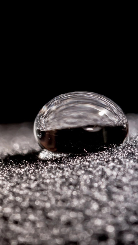 Drops of water close-up macro on velvet material