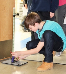 Student William Heskett adjusts the angle on a rocket launcher to change its trajectory. Heskett is a seventh-grade student in the Wyandotte Public Schools STEM program. Student William Heskett adjusts the angle on a rocket launcher to change its trajectory. Heskett is a seventh-grade student in the Wyandotte Public Schools STEM program.