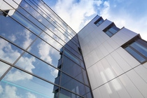 The facade is designed in six different grey-blue nuances that change depending on the perspective and the daylight, The facade is designed in six different grey-blue nuances that change depending on the perspective and the daylight,