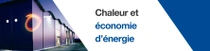 Un bâtiment moderne à l’extérieur au crépuscule avec des lumières allumées.  Un tourbillon lumineux flotte au bord du bâtiment. Le texte indique : « Une vie au chaud en baissant la consommation d’énergie. »  Un bâtiment moderne à l’extérieur au crépuscule avec des lumières allumées.  Un tourbillon lumineux flotte au bord du bâtiment. Le texte indique : « Une vie au chaud en baissant la consommation d’énergie. »