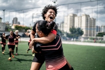 Two female soccer players celebrate their win Two female soccer players celebrate their win